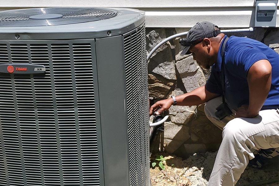 home-inspector-looking-at-exterior-hvac-unit-climax-nc